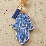 Cross-border hot-selling devil's eye palm keychain korean velvet hot diamond fashion bag blue eyes tassel accessories