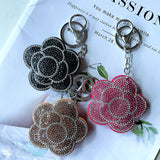 Cross-border rose plum blossom camellia korean velvet hot diamond keychain fashionable cute bag car pendant wholesale
