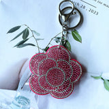 Cross-border rose plum blossom camellia korean velvet hot diamond keychain fashionable cute bag car pendant wholesale