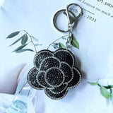 Cross-border rose plum blossom camellia korean velvet hot diamond keychain fashionable cute bag car pendant wholesale